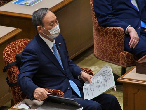 菅首相は東京オリンピック・パラリンピックにどう臨むのか(写真:アフロ)