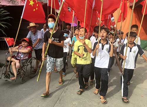 <b>広東省・烏坎村の村長逮捕に村民が抗議デモ。子供たちも参加した</b>（写真：ロイター/アフロ）
