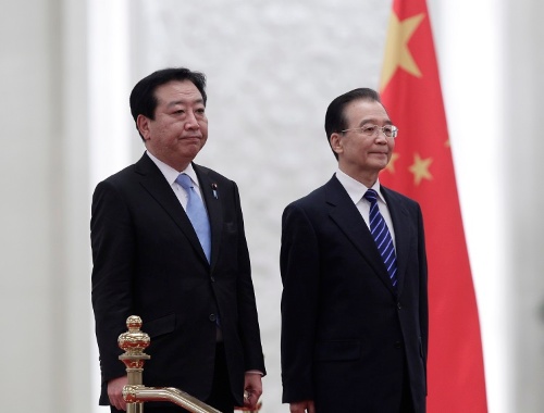 前回の首相訪中は2011年12月、日中関係が悪化するなか、当時の野田首相が温家宝首相と会談した(写真:AP/アフロ)