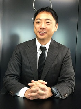 「主婦らの負担を何とか軽減したい」と語る阪根社長