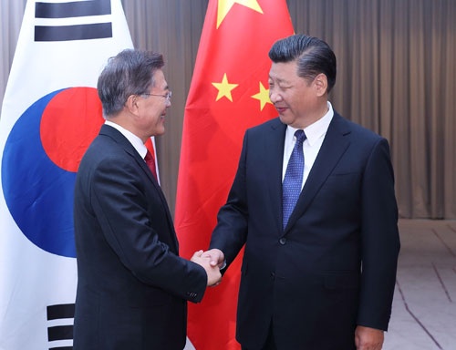 7月6日に中韓首脳がドイツ・ベルリンで初会談。習近平主席は米韓分断に全力を挙げた(写真:新華社/アフロ)