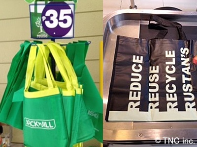 スーパーで販売されているエコバッグ。「リデュース、リユース、リサイクル」などエコを啓発する文言が入るバッグもある