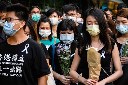 香港 民主化デモ参加者の死から1年(写真:AFP/アフロ)